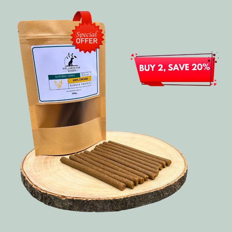 Pack of chicken meat sticks for dogs on a wooden plate