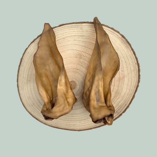 Two venison ear dog treats.