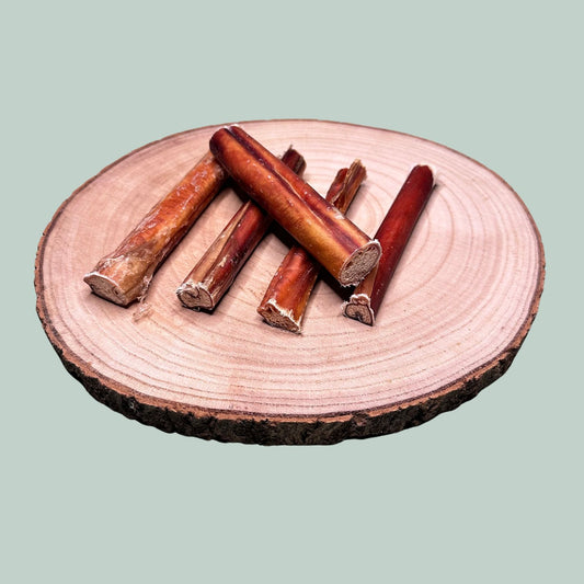 A pack of 5 dried beef pizzle bully sticks as a natural treat for dogs