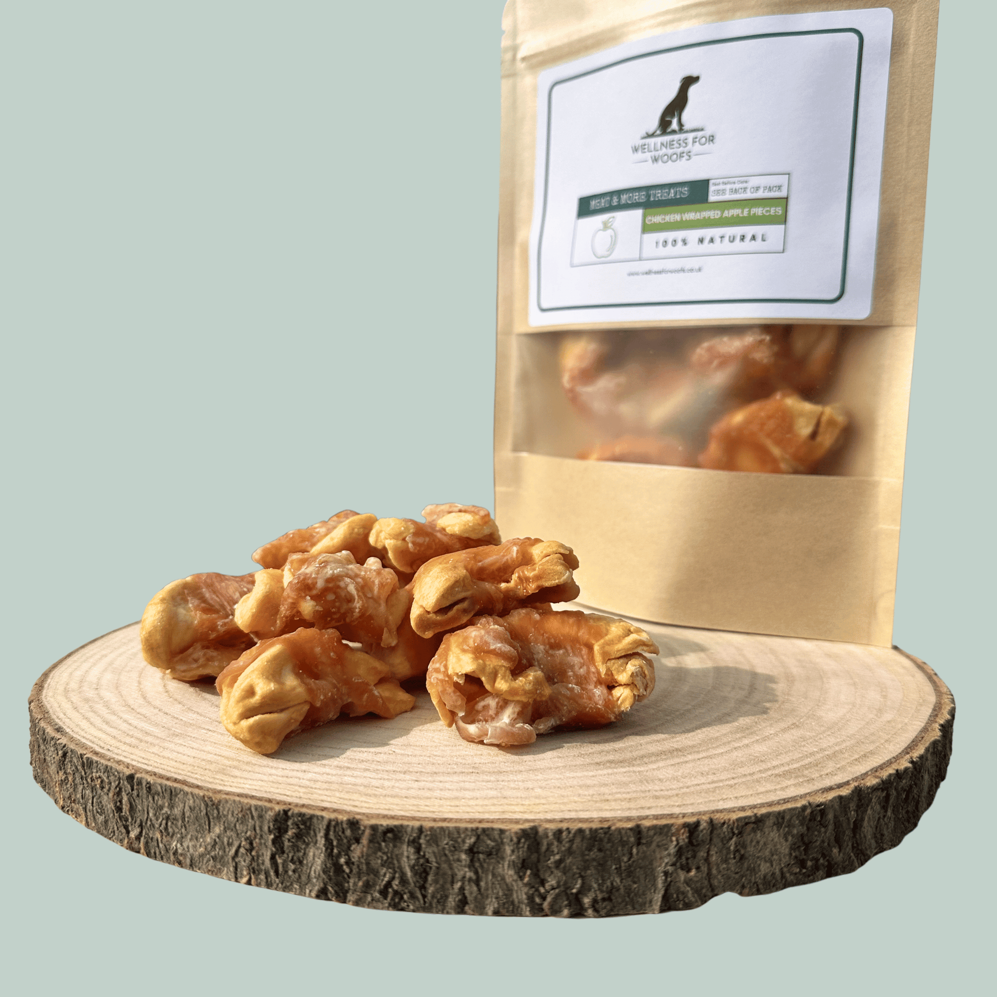 Dog treats on a wooden platform with a branded packaging bag in the background