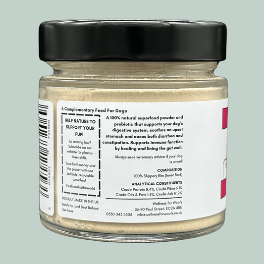 A glass jar containing Slippery Elm Powder for dogs. The label explains the benefits of slippery elm for dogs and that the prebiotic supports the dog's immune function by healing and lining the gut wall. The label also explains how the customer can be environmentally friendly and promote sustainability by signing up for kerbside recyclable refill pouches.