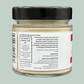 A glass jar containing Slippery Elm Powder for dogs. The label explains the benefits of slippery elm for dogs and that the prebiotic supports the dog's immune function by healing and lining the gut wall. The label also explains how the customer can be environmentally friendly and promote sustainability by signing up for kerbside recyclable refill pouches.