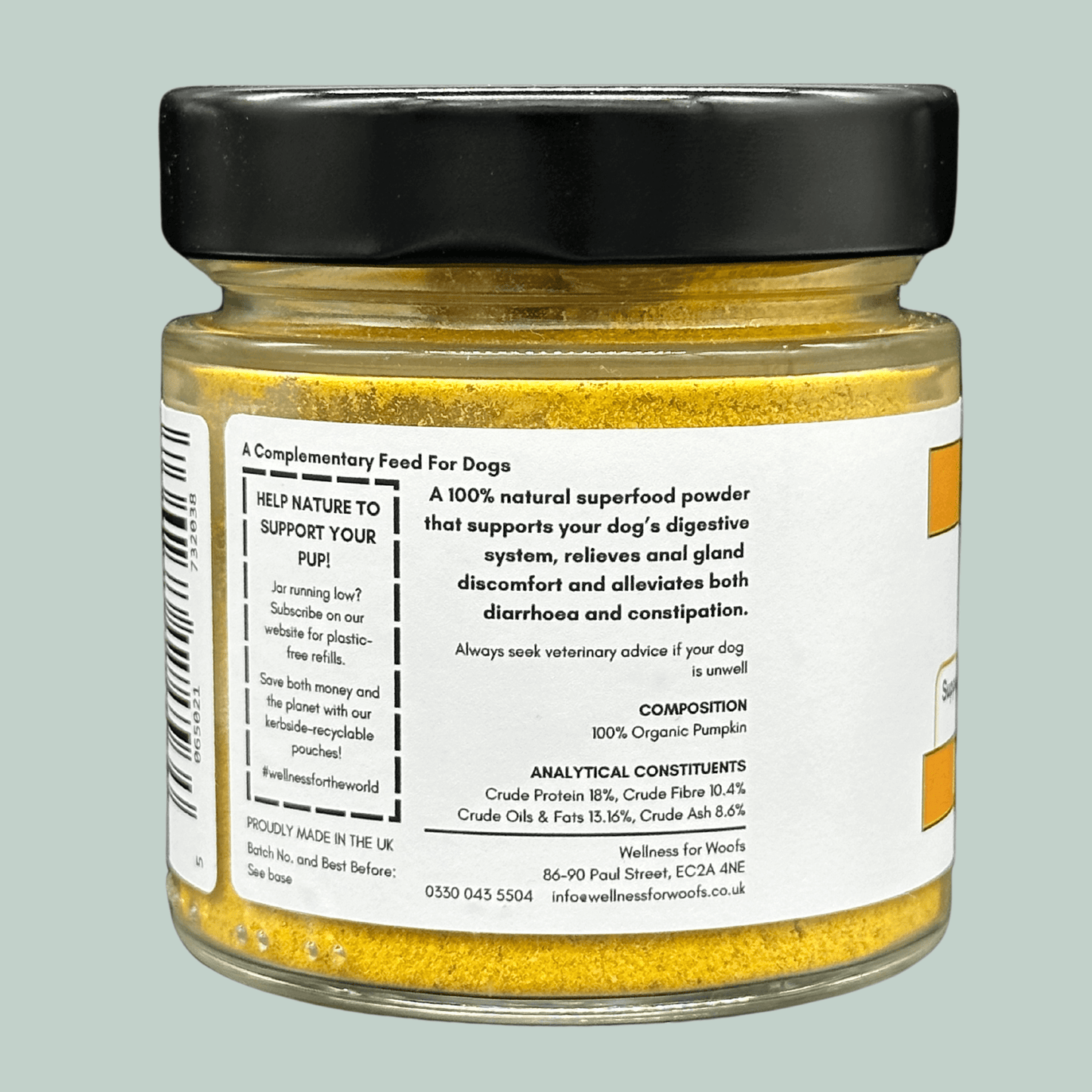 Side of a glass jar containing organic pumpkin powder for dogs. The label gives information on the benefits of pumpkin powder for dogs and the ingredients and analytical constituents, as well as explaining how the customer can be eco-conscious and promote sustainability by signing up for refill subscriptions on the company website.