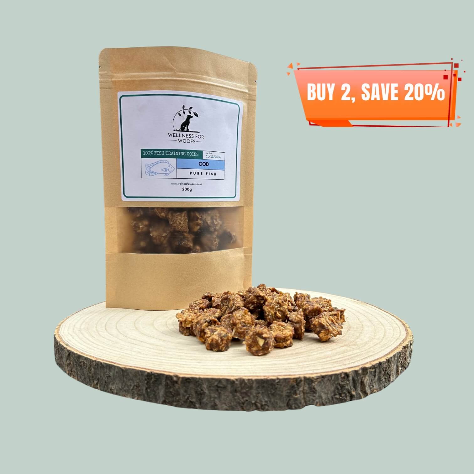 Pouch of Cod Training Treats for dogs with a pile of treats next to it, all on a wooden plate