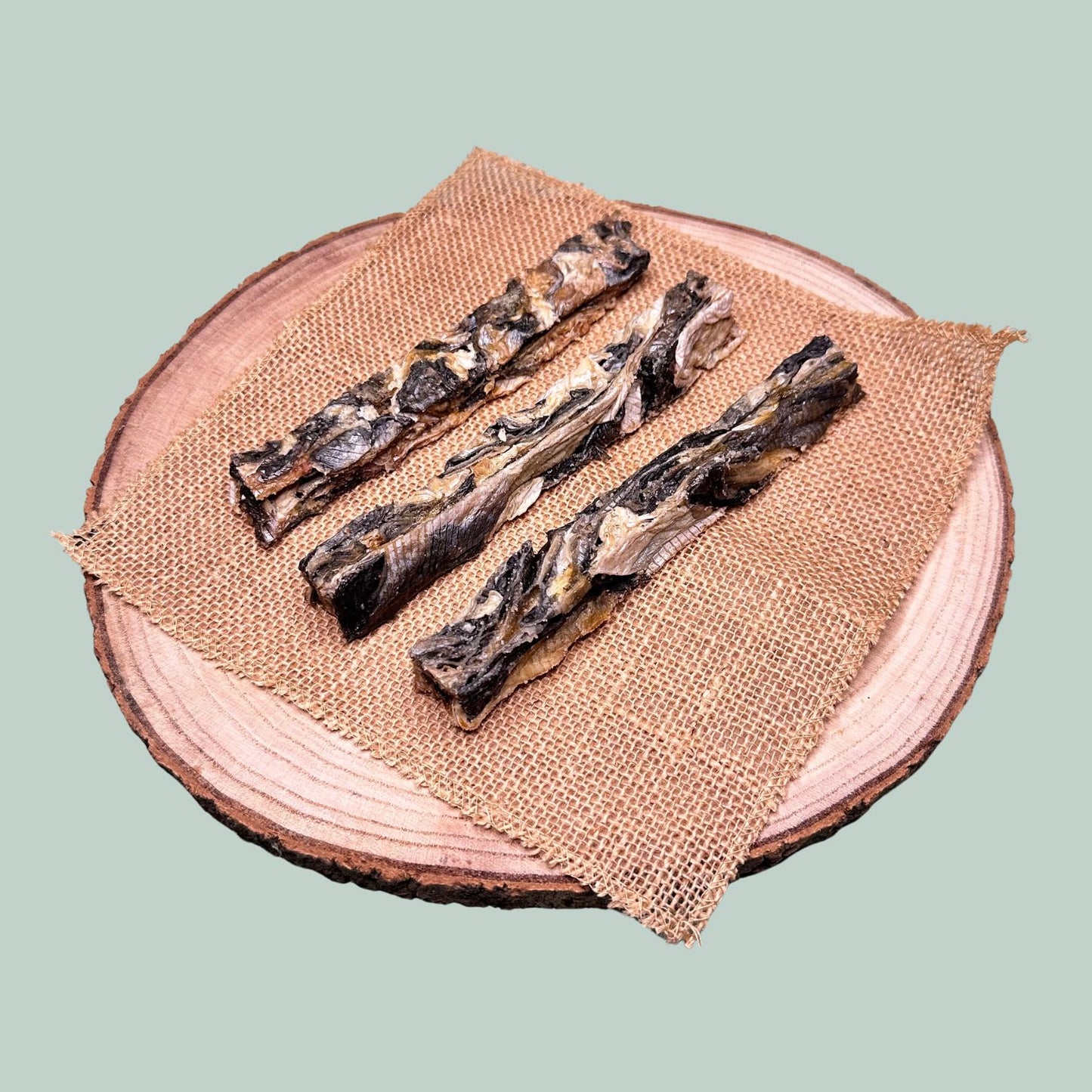 3 dried fish finger dog treats made from natural basa fish skin