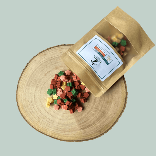 Bag of dog treats with a label on a wooden surface