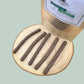 Dog treats sat on a wooden plate next to a pouch that's labelled 'Jumbo sausage sticks 100% guinea fowl'
