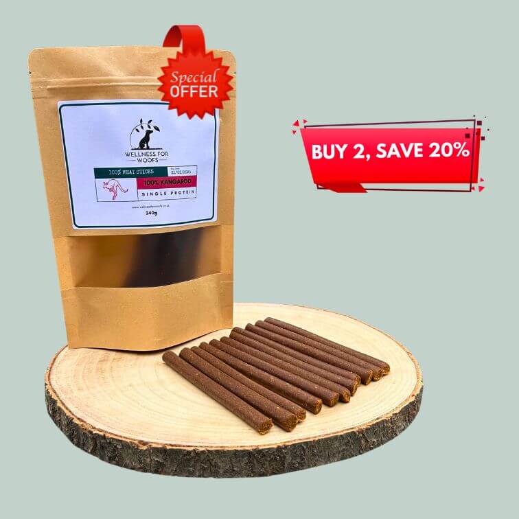 Pack of kangaroo meat sticks for dogs on a wooden plate