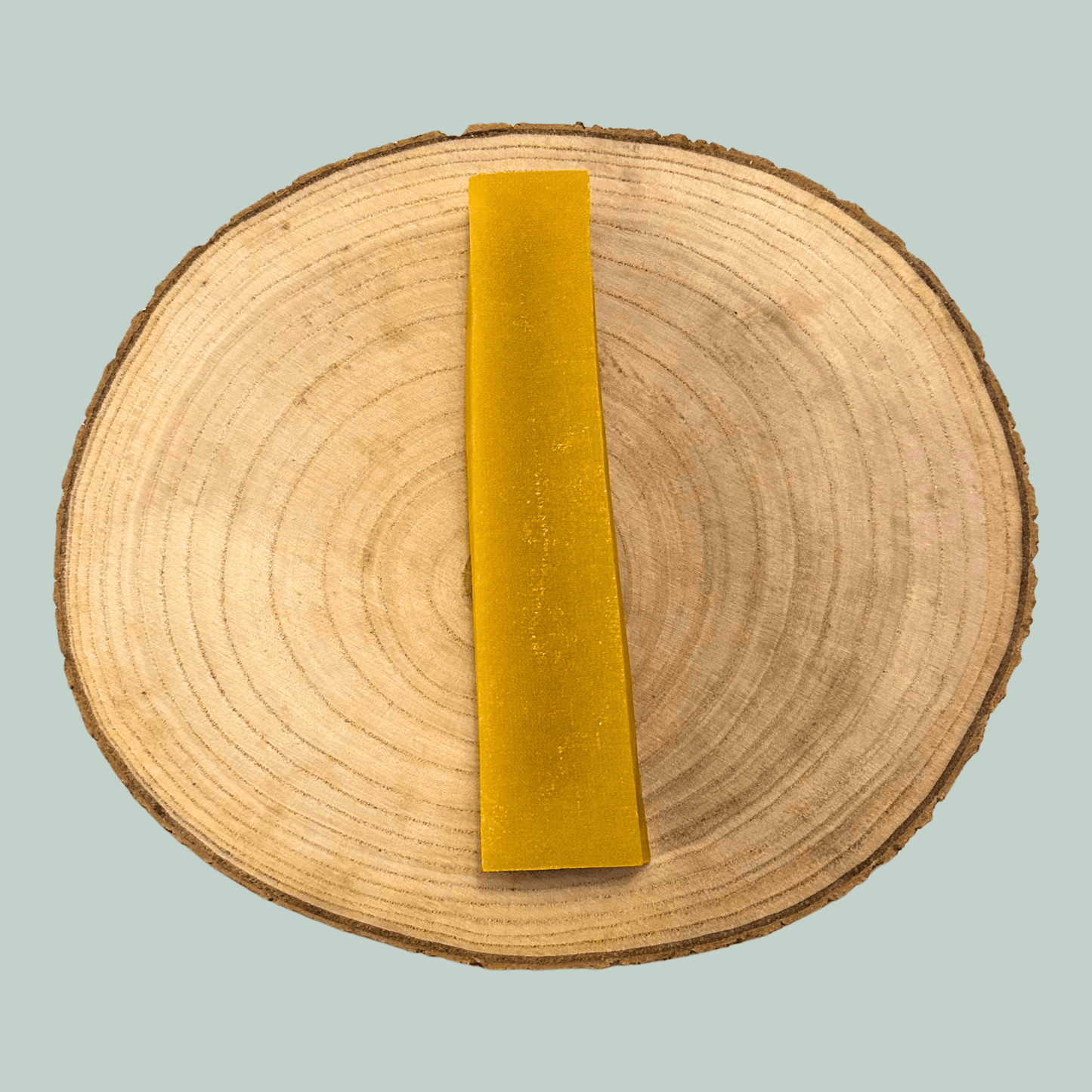 Mango yak bar on a wooden circular platform with a light blue background