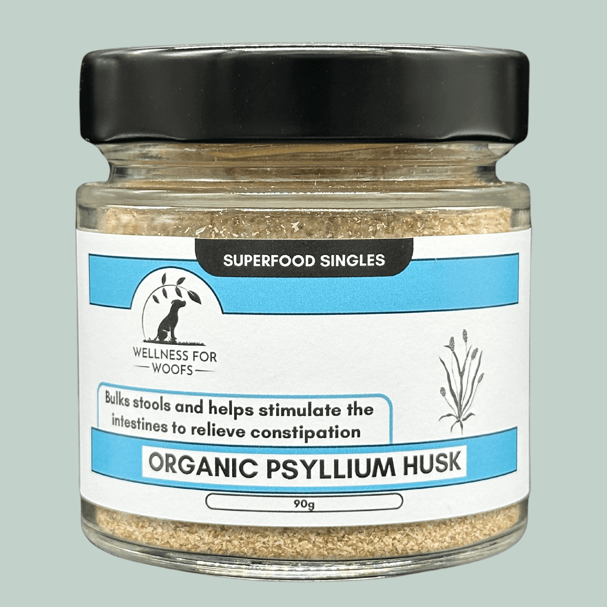 Glass jar with a black lid containing Organic Psyllium Husk food topper for dogs. The label is blue and white and explains that psyllium husk bulks dogs stools and helps to stimulate the intestines to relieve constipation.