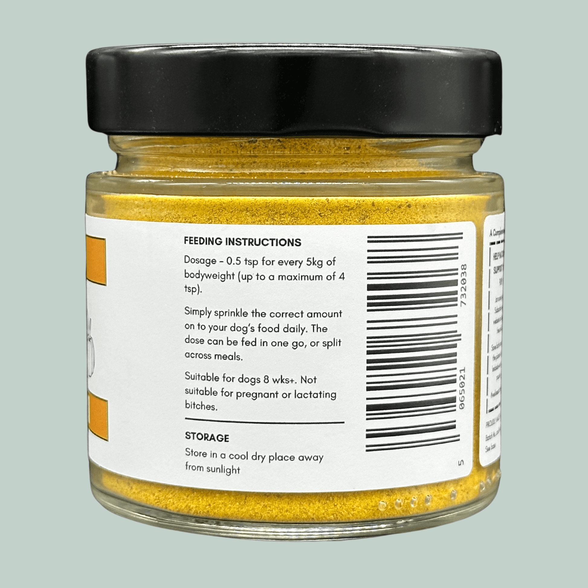 Side of a glass jar containing organic pumpkin powder for dogs. The label explains the dosage and feeding instructions.