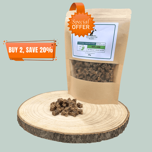 A pouch of single protein pure lamb meat training treats for dogs. The pouch is on a wooden slice plate beside a pile of the treats. Notices on the image state that the dog treats are on special offer.