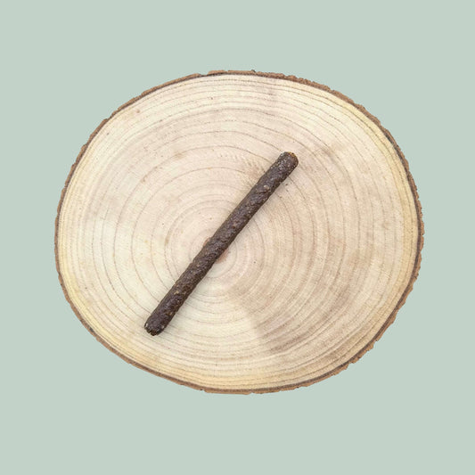 Sausage Dog treat on a wooden plate