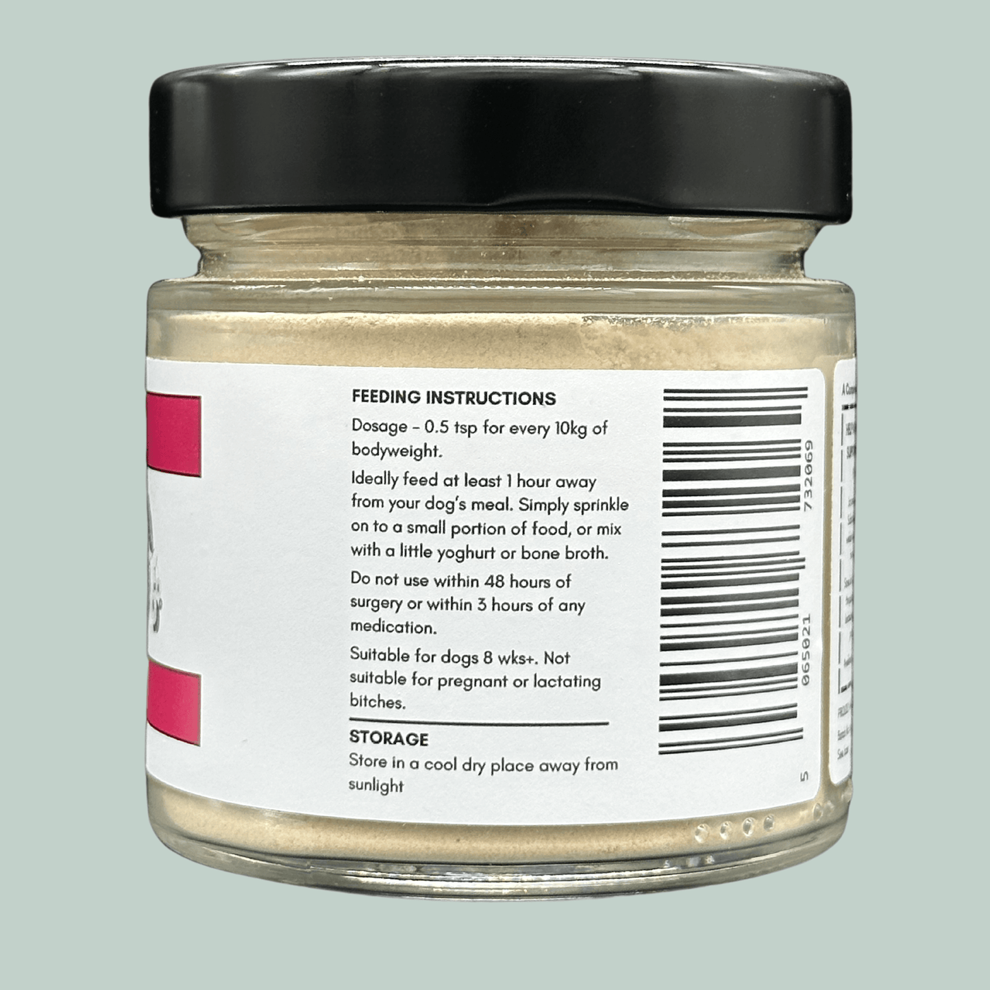 A glass jar containing Slippery Elm powder for dogs. The label explains the dosage and feeding instructions.