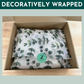 Decoratively gift wrapped treat box for dogs